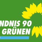 Logo von BÜNDNIS/DIE GRÜNEN Ortsverband Uetersen mit Sonnenblume und grünem Hintergrund